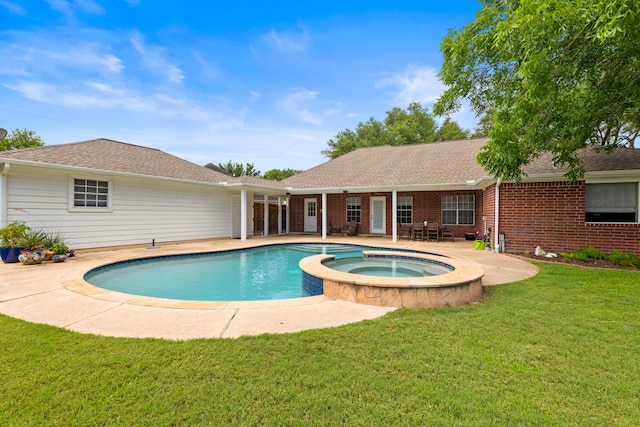 6509 Patricia St, Katy, TX 77493 - view of swimming pool featuring a yard, a patio, and a pool with connected hot tub