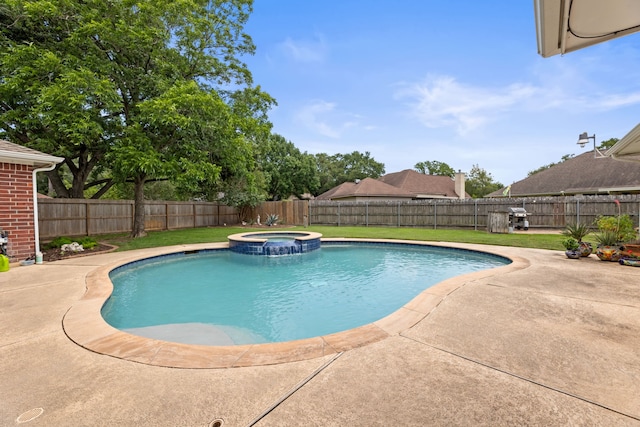 6509 Patricia St, Katy, TX 77493 - view of pool with a patio, a pool with connected hot tub, and a grill
