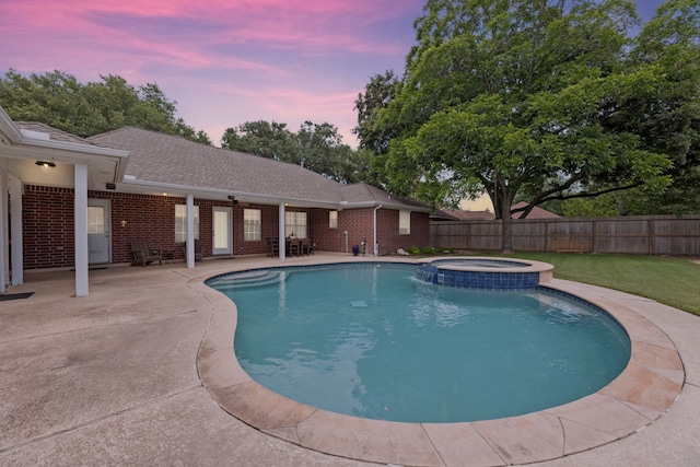 6509 Patricia St, Katy, TX 77493 - pool at dusk with a patio area and a pool with connected hot tub