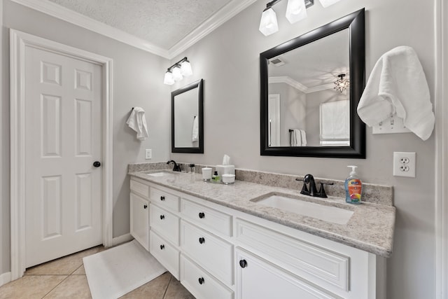 6509 Patricia St, Katy, TX 77493 - bathroom with double vanity, tile patterned floors, a textured ceiling, and ornamental molding