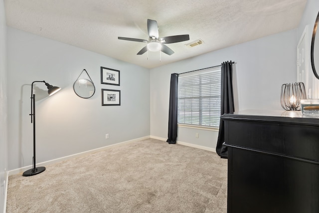 6509 Patricia St, Katy, TX 77493 - bedroom with carpet floors, baseboards, a textured ceiling, and ceiling fan
