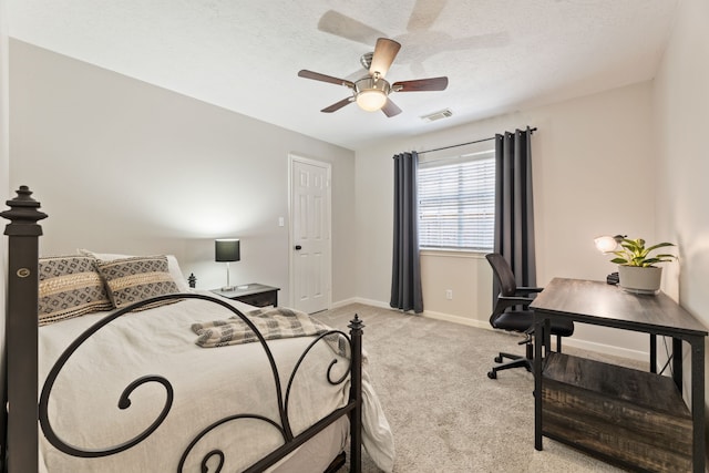 6509 Patricia St, Katy, TX 77493 - bedroom with light carpet, an office area, baseboards, ceiling fan, and a textured ceiling