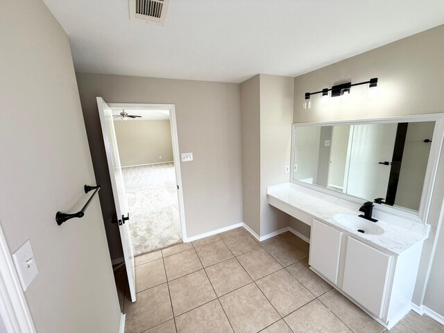 3403 Fox Ct, Pearland, TX 77581 - bathroom with vanity, baseboards, tile patterned flooring, and a ceiling fan