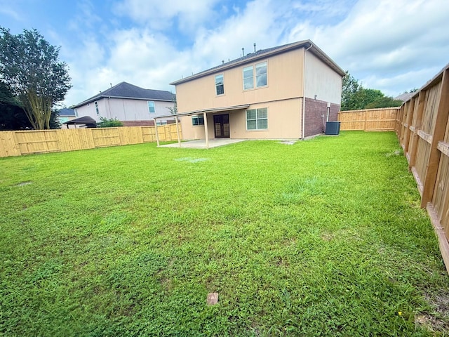 3403 Fox Ct, Pearland, TX 77581 - back of property with a patio and cooling unit