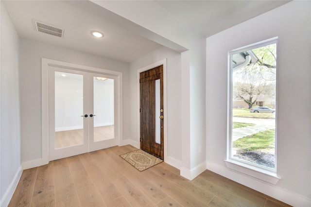 1810 Eagle Falls Ct, Houston, TX 77077 - foyer featuring french doors, light wood-style floors, baseboards, and recessed lighting