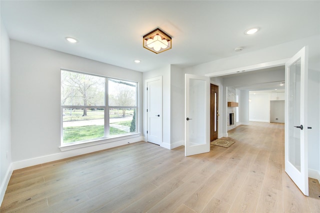 1810 Eagle Falls Ct, Houston, TX 77077 - unfurnished room featuring french doors, plenty of natural light, baseboards, and recessed lighting