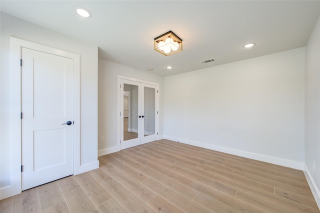 1810 Eagle Falls Ct, Houston, TX 77077 - unfurnished bedroom with french doors, light wood-style floors, baseboards, and recessed lighting