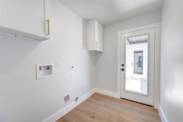 1810 Eagle Falls Ct, Houston, TX 77077 - laundry room featuring electric dryer hookup, cabinet space, hookup for a washing machine, light wood-style flooring, and baseboards