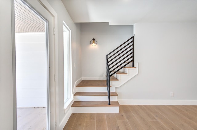1810 Eagle Falls Ct, Houston, TX 77077 - stairway with wood finished floors, plenty of natural light, and baseboards