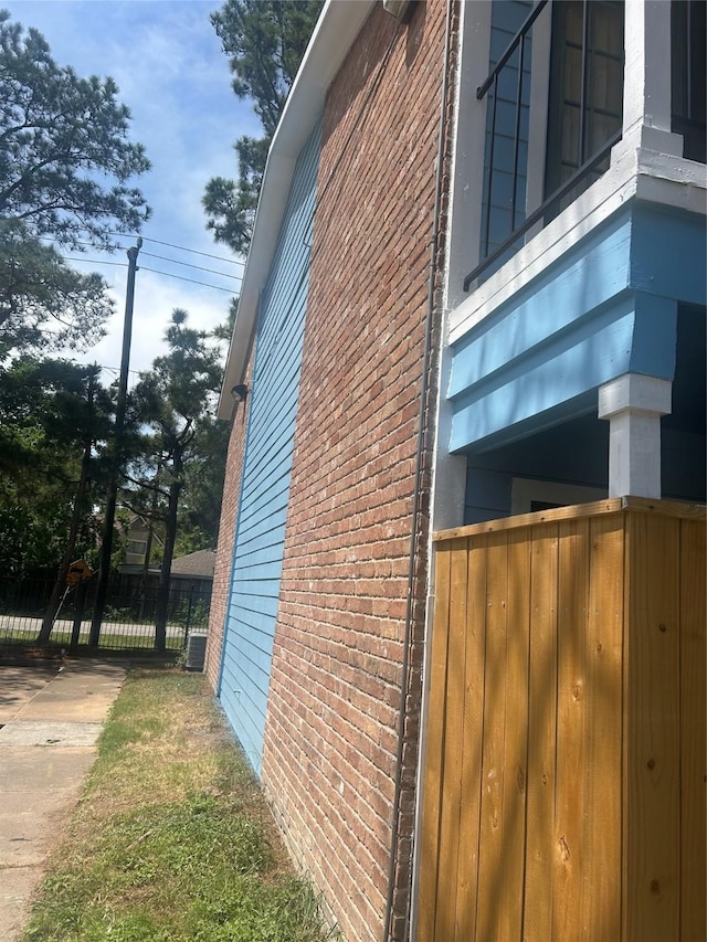 7402 Alabonson Rd Unit 202, Houston, TX 77088 - view of side of property featuring brick siding