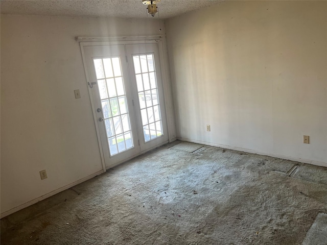 7402 Alabonson Rd Unit 202, Houston, TX 77088 - empty room featuring carpet flooring, healthy amount of natural light, a textured ceiling, and baseboards