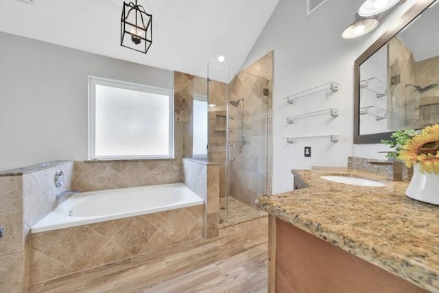 1223 Berrystone Trl, Missouri City, TX 77459 - bathroom with a shower stall, a bath, vaulted ceiling, and vanity