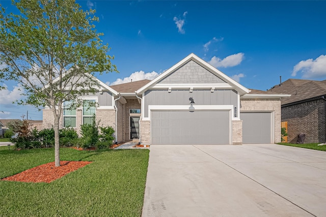 4507 Mustang Run Dr, Rosenberg, TX 77469 - view of front of property with a garage, driveway, a front yard, and brick siding