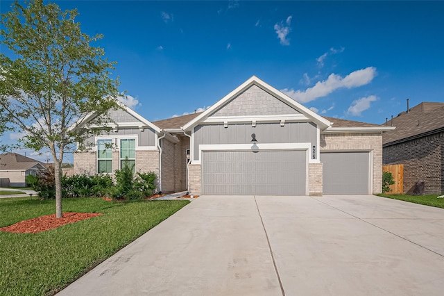 4507 Mustang Run Dr, Rosenberg, TX 77469 - view of front of house with brick siding, an attached garage, board and batten siding, and driveway