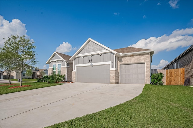 4507 Mustang Run Dr, Rosenberg, TX 77469 - view of front of house with board and batten siding, an attached garage, driveway, and brick siding