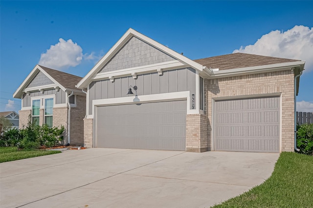 4507 Mustang Run Dr, Rosenberg, TX 77469 - view of front facade with a garage, board and batten siding, driveway, and brick siding