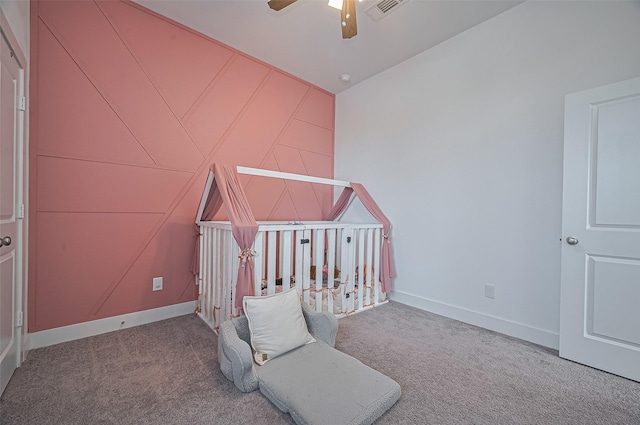 4507 Mustang Run Dr, Rosenberg, TX 77469 - unfurnished bedroom with carpet flooring, baseboards, a ceiling fan, and a crib