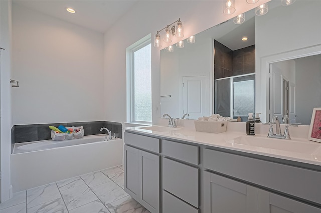 4507 Mustang Run Dr, Rosenberg, TX 77469 - bathroom featuring double vanity, a garden tub, a stall shower, marble finish flooring, and recessed lighting