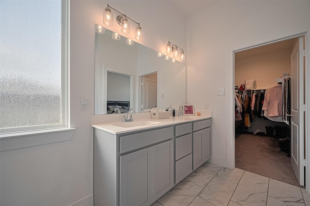 4507 Mustang Run Dr, Rosenberg, TX 77469 - full bathroom with double vanity, a spacious closet, and marble finish flooring
