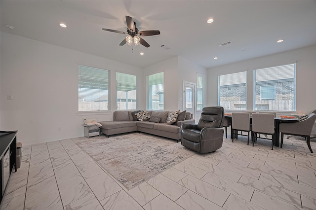 4507 Mustang Run Dr, Rosenberg, TX 77469 - living area with light marble finish flooring, a ceiling fan, and recessed lighting
