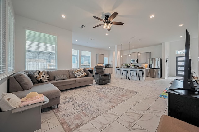 4507 Mustang Run Dr, Rosenberg, TX 77469 - living area with light marble finish flooring, ceiling fan, and recessed lighting