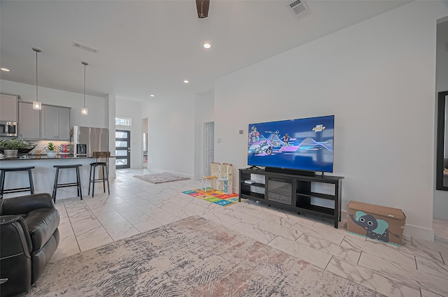 4507 Mustang Run Dr, Rosenberg, TX 77469 - living room featuring light marble finish floors and recessed lighting