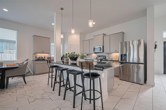 4507 Mustang Run Dr, Rosenberg, TX 77469 - kitchen featuring appliances with stainless steel finishes, gray cabinets, light marble finish flooring, and recessed lighting