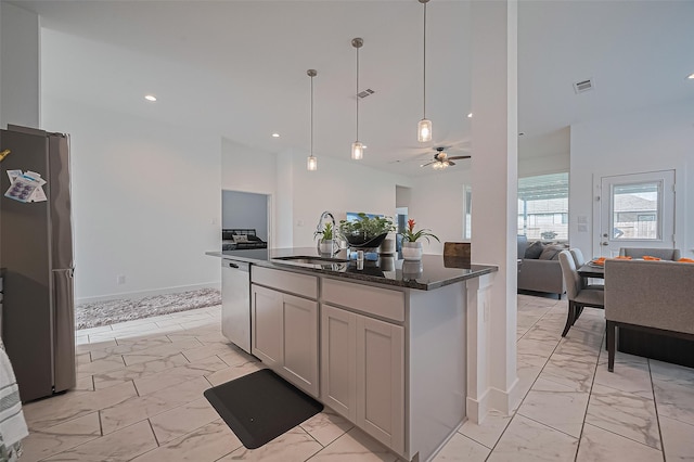 4507 Mustang Run Dr, Rosenberg, TX 77469 - kitchen featuring stainless steel appliances, light marble finish floors, open floor plan, a sink, and ceiling fan
