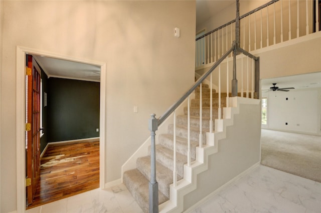 1802 Cobblestone Ct, Richmond, TX 77406 - stairs with marble look tiles, baseboards, and a ceiling fan