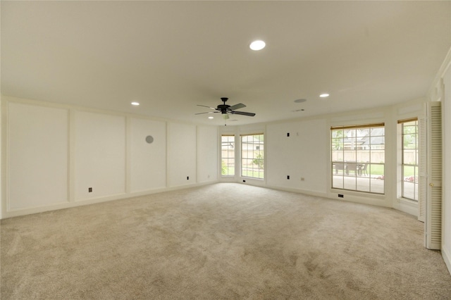 1802 Cobblestone Ct, Richmond, TX 77406 - empty room featuring light carpet, recessed lighting, ceiling fan, and plenty of natural light