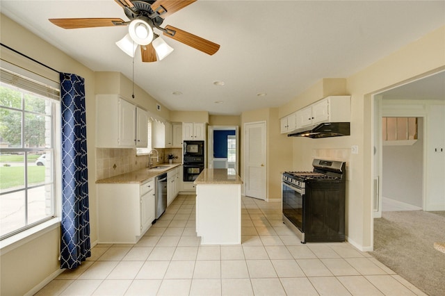 1802 Cobblestone Ct, Richmond, TX 77406 - kitchen featuring black appliances, a sink, under cabinet range hood, a ceiling fan, and white cabinets