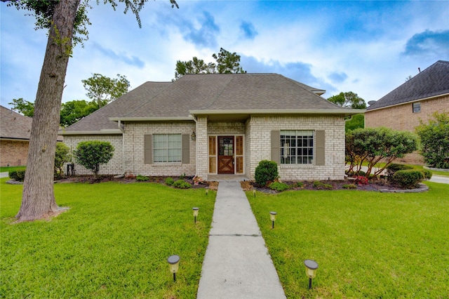 1802 Cobblestone Ct, Richmond, TX 77406 - view of front facade with a front yard and brick siding