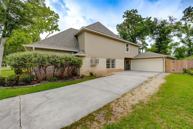 1802 Cobblestone Ct, Richmond, TX 77406 - view of front of house with brick siding, a garage, driveway, and a shingled roof