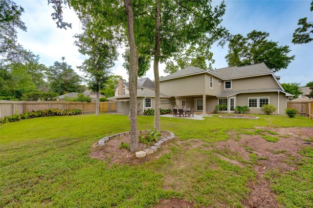 1802 Cobblestone Ct, Richmond, TX 77406 - back of house with a patio area