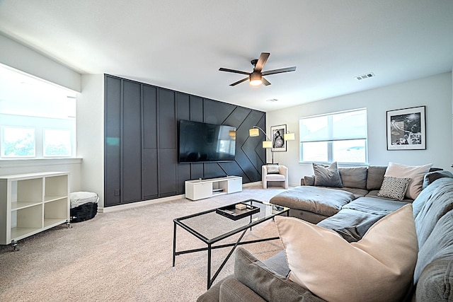 2003 Jitterbug Ln, Katy, TX 77493 - living room with healthy amount of natural light, ceiling fan, carpet flooring, and an accent wall