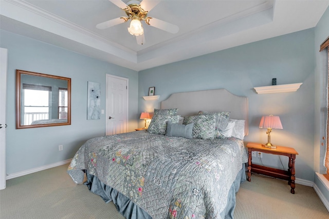 247 Isles End Rd, Tiki Island, TX 77554 - bedroom with carpet, baseboards, crown molding, and a raised ceiling