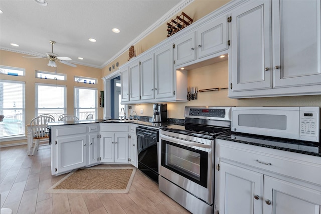 247 Isles End Rd, Tiki Island, TX 77554 - kitchen with stainless steel electric range oven, black dishwasher, white microwave, ornamental molding, and a peninsula