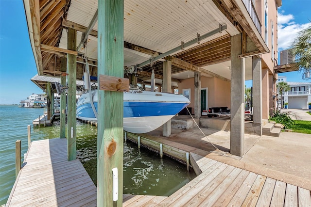 247 Isles End Rd, Tiki Island, TX 77554 - dock area featuring boat lift and a water view