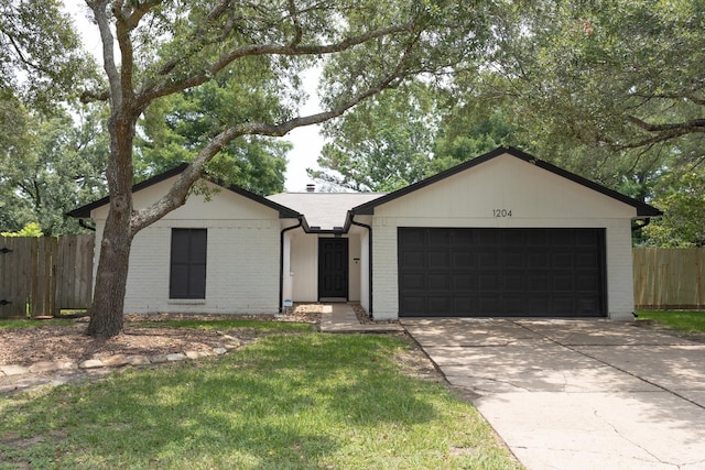 1204 Osborne Dr, Friendswood, TX 77546 - ranch-style home with a garage, driveway, and brick siding