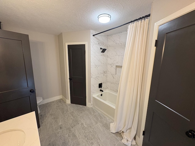 1204 Osborne Dr, Friendswood, TX 77546 - full bath featuring shower / bath combo, toilet, a textured ceiling, baseboards, and vanity