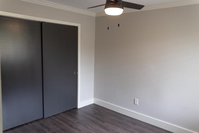 1204 Osborne Dr, Friendswood, TX 77546 - unfurnished bedroom featuring crown molding, dark wood-type flooring, baseboards, ceiling fan, and a closet