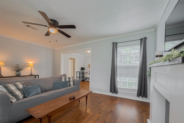 810 Stubbs St, La Marque, TX 77568 - living area with wood finished floors, a ceiling fan, baseboards, and ornamental molding