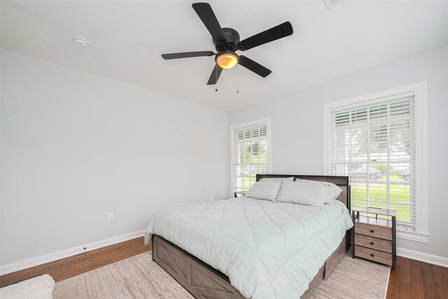 810 Stubbs St, La Marque, TX 77568 - bedroom with baseboards, wood finished floors, and a ceiling fan