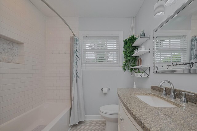 810 Stubbs St, La Marque, TX 77568 - full bathroom featuring vanity, toilet, shower / bath combination with curtain, and tile patterned floors