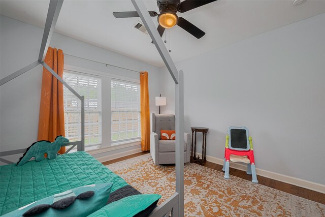 810 Stubbs St, La Marque, TX 77568 - bedroom with light wood-type flooring, baseboards, and ceiling fan