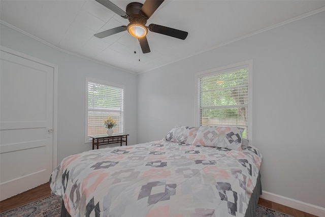 810 Stubbs St, La Marque, TX 77568 - bedroom with wood finished floors, ornamental molding, baseboards, and a ceiling fan