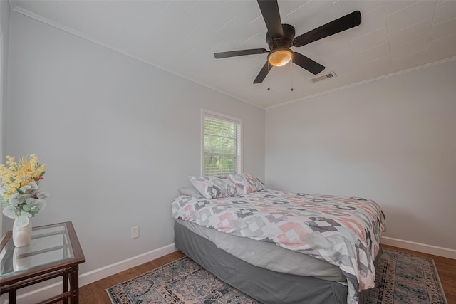 810 Stubbs St, La Marque, TX 77568 - bedroom with crown molding, wood finished floors, baseboards, and ceiling fan