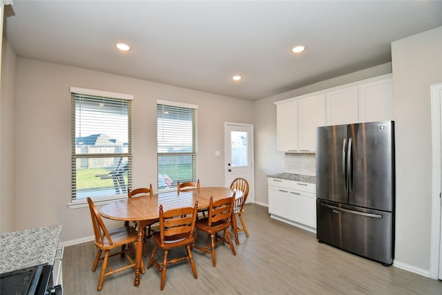 7419 French Quarter Ct, Fulshear, TX 77441 - dining area with light wood-style flooring, baseboards, and recessed lighting