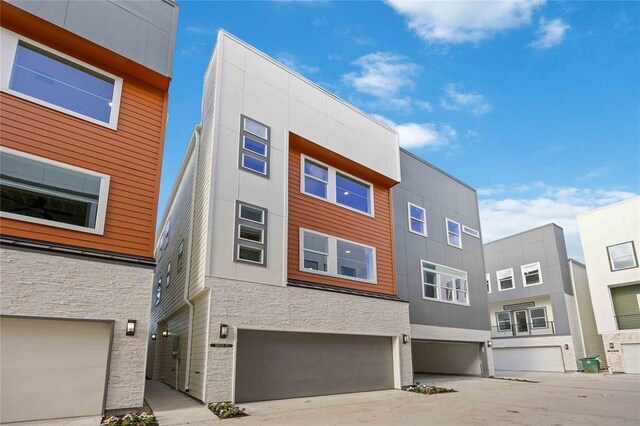 1805 Emir St Unit D, Houston, TX 77009 - view of building exterior featuring an attached garage