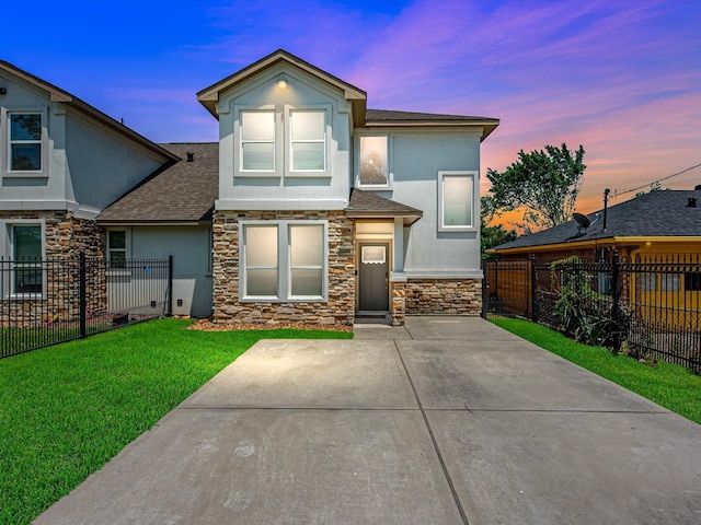 7718 Duncan St, Houston, TX 77093 - view of front of house with stucco siding, stone siding, and roof with shingles